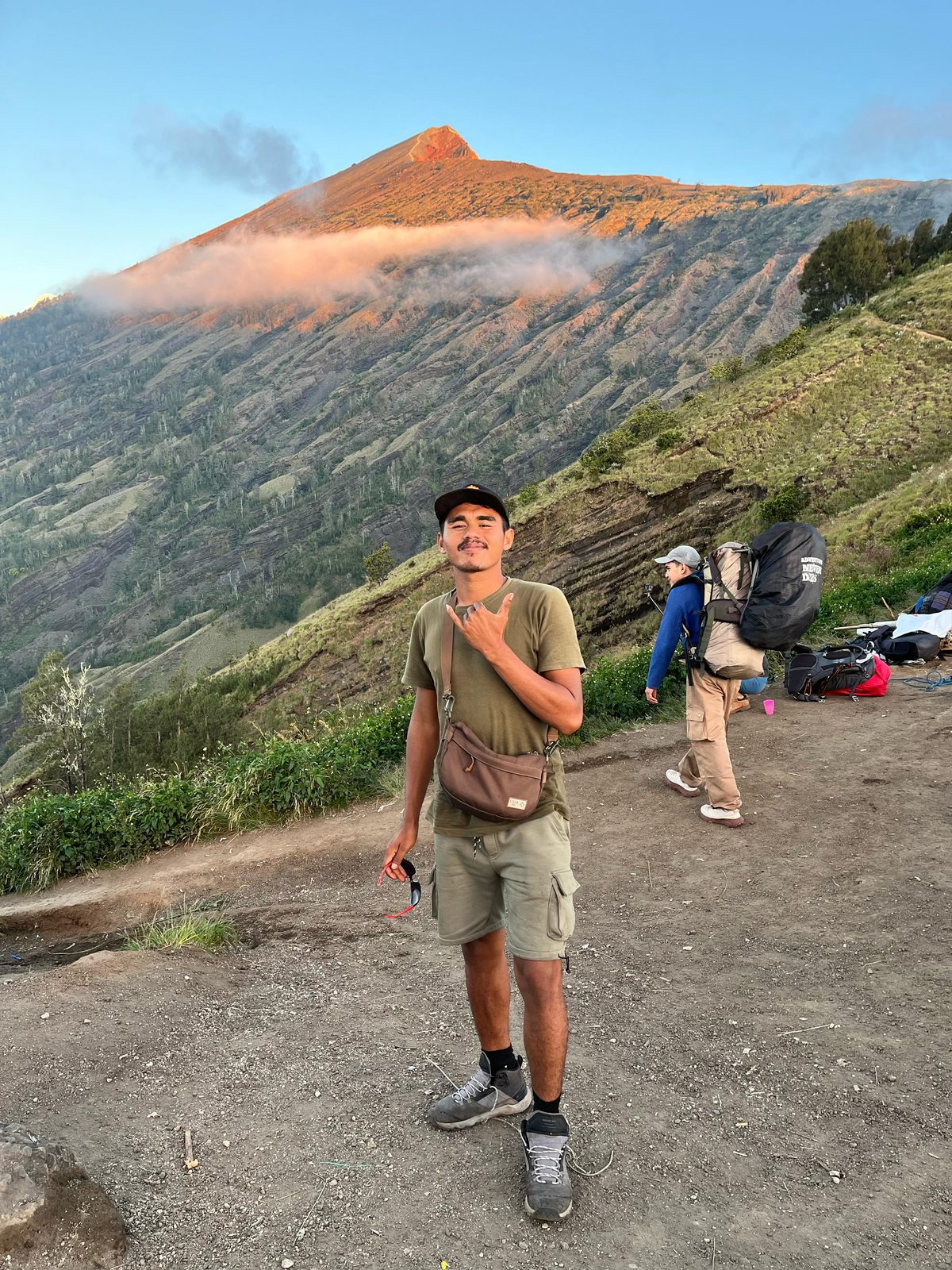 Zainal — lead guide on the Rinjani trek, standing on the crater rim